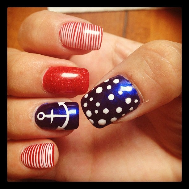 Fingernails painted red, red with white stripes, a white anchor and blue with white dots. My nails felt as healthy as these look.